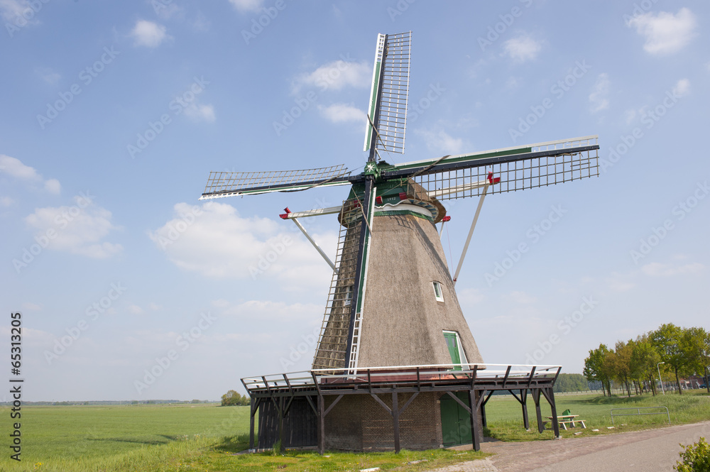 Hay wind mill in rural landscape