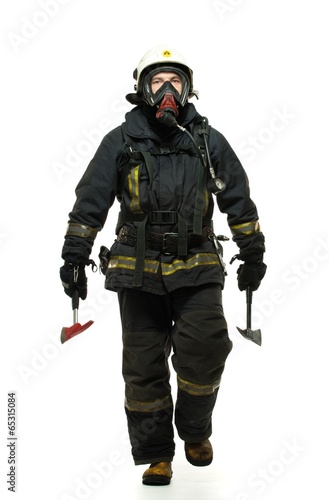 Firefighter with axe and wearing oxygen mask isolated on white