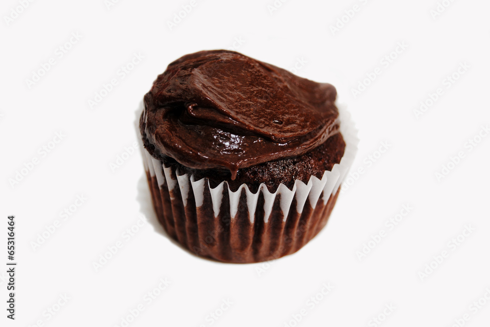 A Chocolate Cupcake with Chocolate Frosting Over White A Chocolate Cupcake with Chocolate Frosting Over White