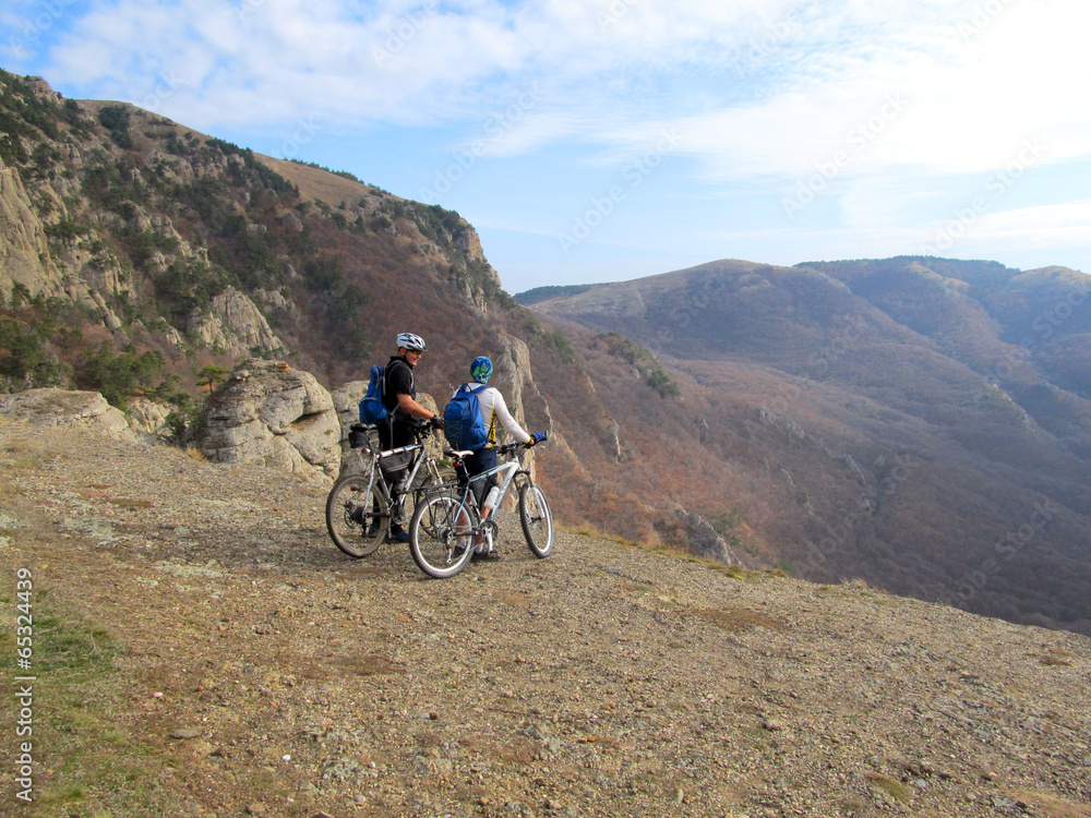 Cyclist Riding the Bike on the Beautiful Spring Mountain Trail Cyclist Riding the Bike on the Beautiful Spring Mountain Trail
