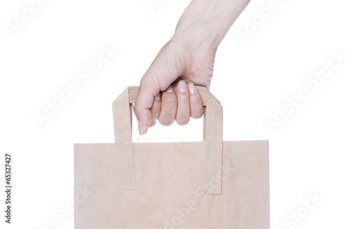Brown paper shopping bag isolated on white background