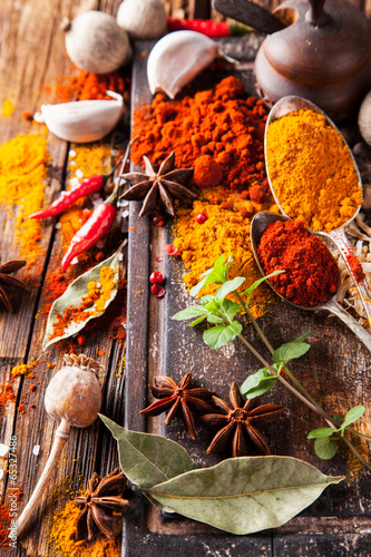 Various spices on wood