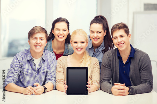smiling students with blank tablet pc screen