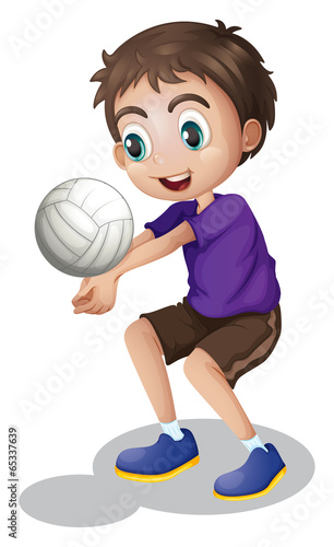 A young boy playing volleyball