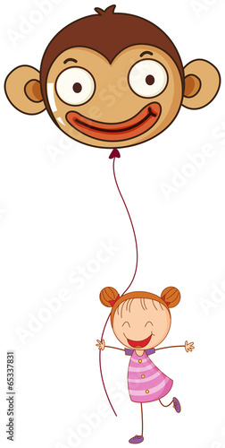A young girl holding a monkey balloon