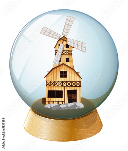 A crystal ball with a wooden house