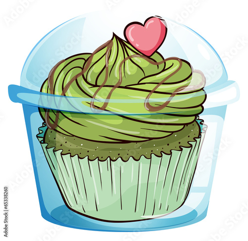 A cupcake with a green icing and a pink heart