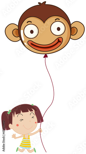 A little girl holding a monkey balloon