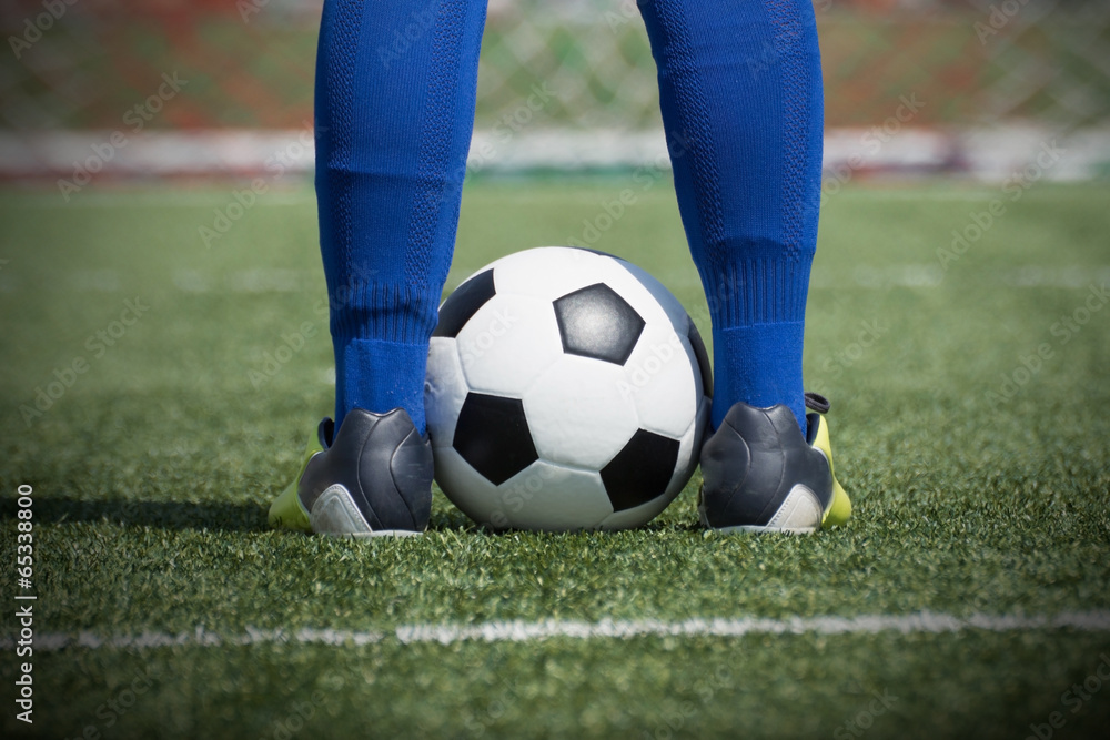 Soccer player's feet on the ball