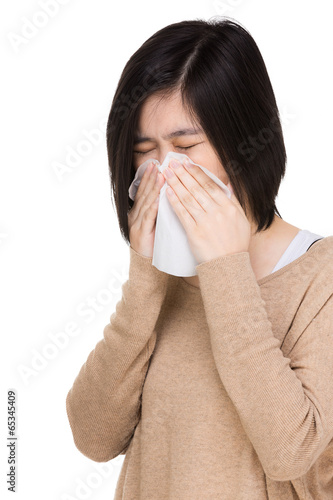 Asia woman blowing nose