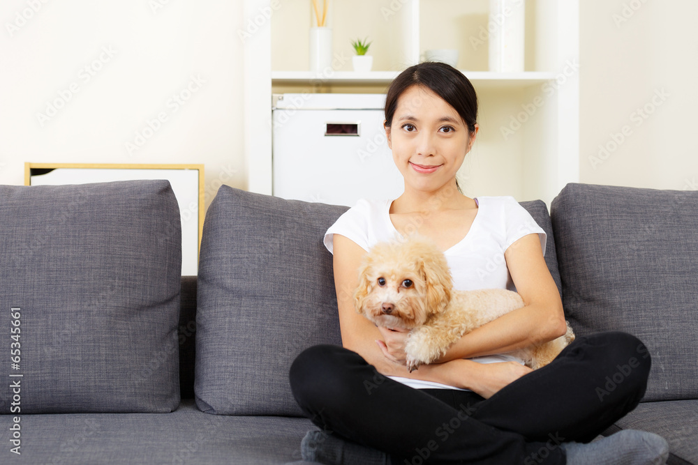 Asia woman and poodle dog at home