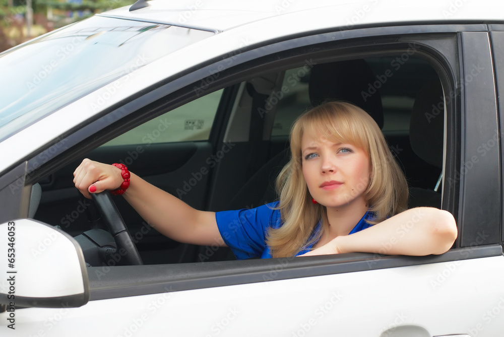 Young woman in car