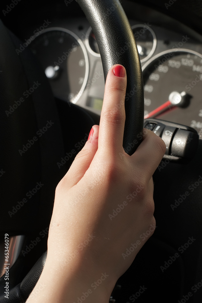 Naklejka premium Young woman in car