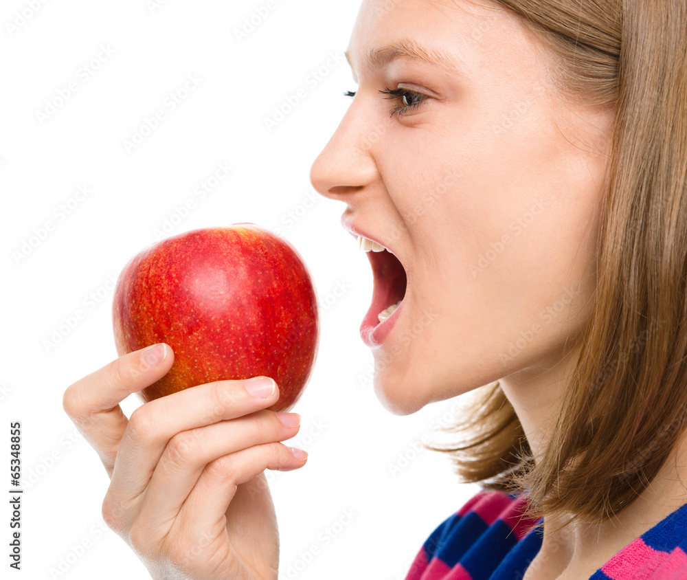 Young happy girl with apple Young happy girl with apple