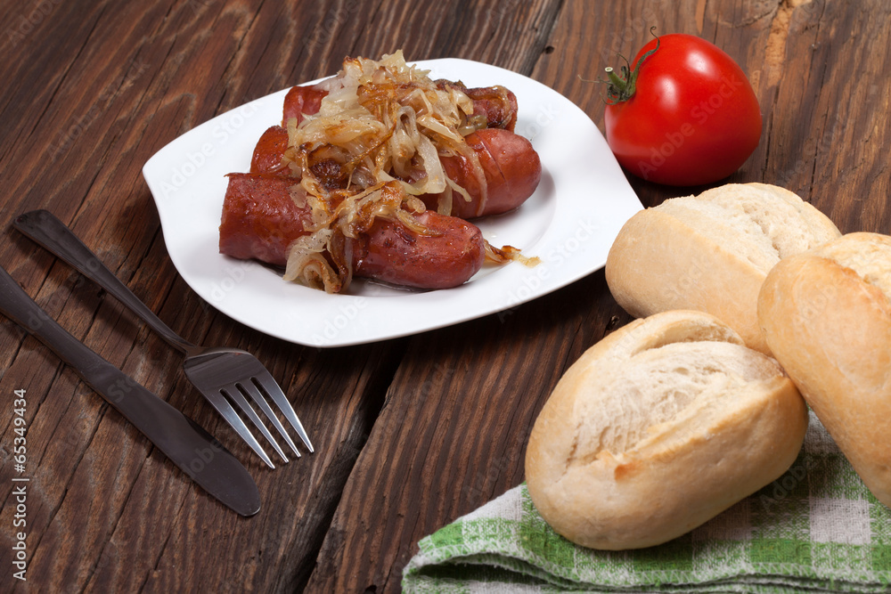 Fried sausage with onions. Fried sausage with onions.