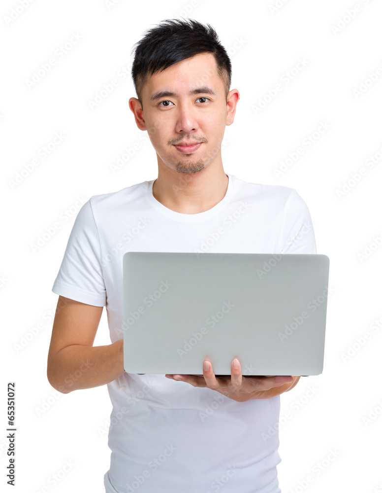 Asian man using laptop computer Asian man using laptop computer
