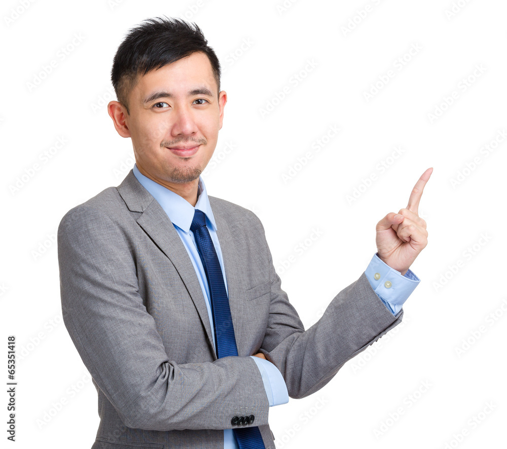 Handsome businessman pointing up with finger Handsome businessman pointing up with finger