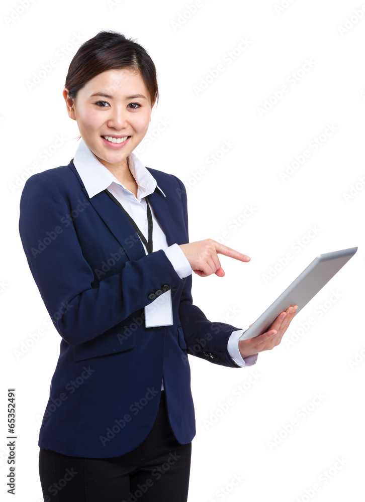 Businesswoman pointing to tablet Businesswoman pointing to tablet