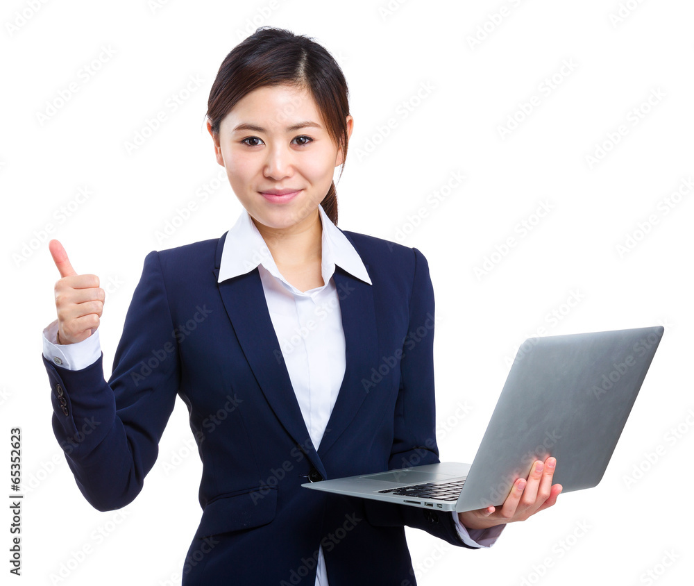 Businesswoman holding laptop with thumb up Businesswoman holding laptop with thumb up