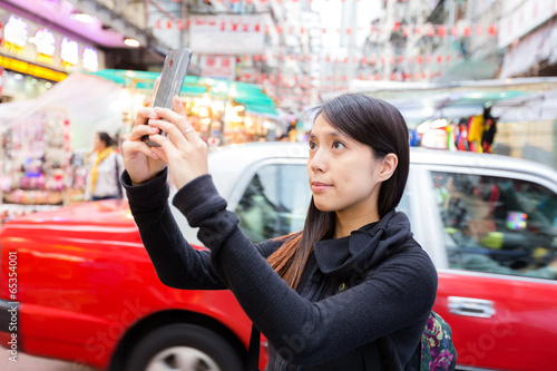 Tourist taking photo in Hong Kong photo