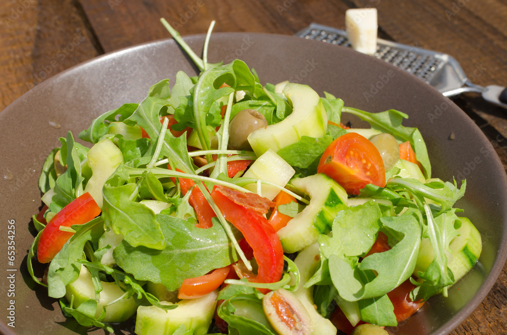 Arugula Salad with tomatoes, olives and parmesan