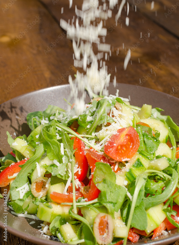 Arugula Salad with tomatoes, olives and parmesan