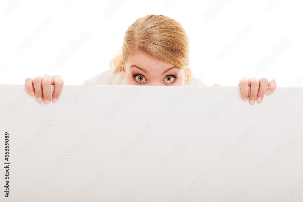 Businesswoman hiding behind blank copy space banner Businesswoman hiding behind blank copy space banner