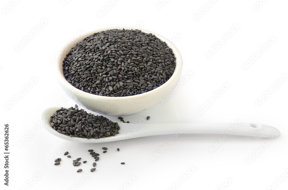 Close up of black sesame in bowl and spoon Close up of black sesame in bowl and spoon