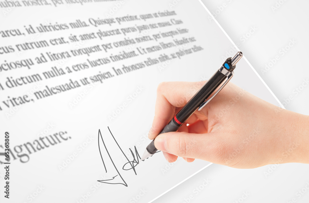 Hand writing personal signature on a paper form Hand writing personal signature on a paper form