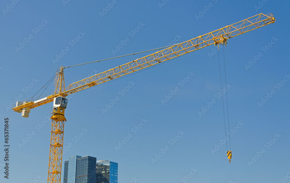 Crane on construction site. Space for your text. Crane on construction site. Space for your text.