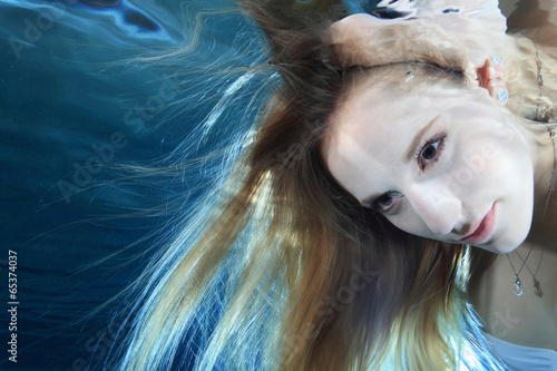 Portrait of young woman underwater
