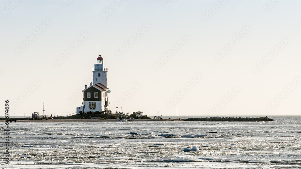 A beautiful beach and lighthouse at sunrise (Marken The Netherla