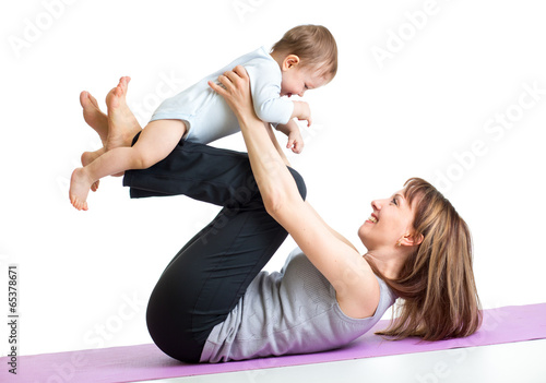 mother with baby do gymnastic exercises