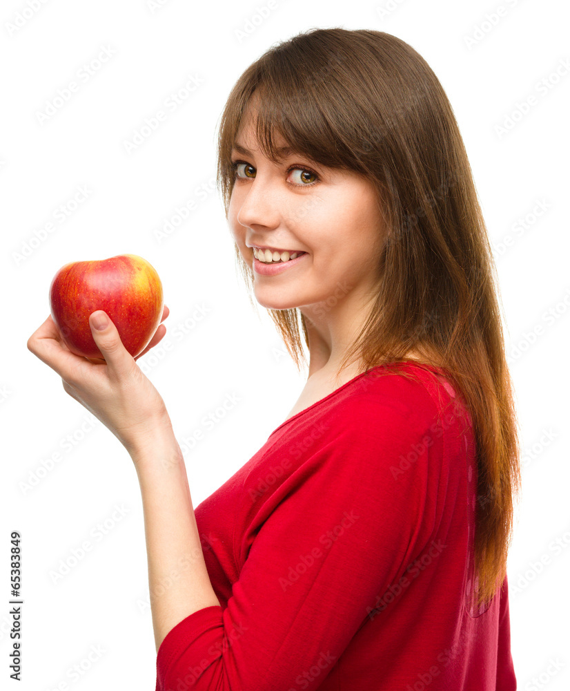Young happy girl with apple Young happy girl with apple