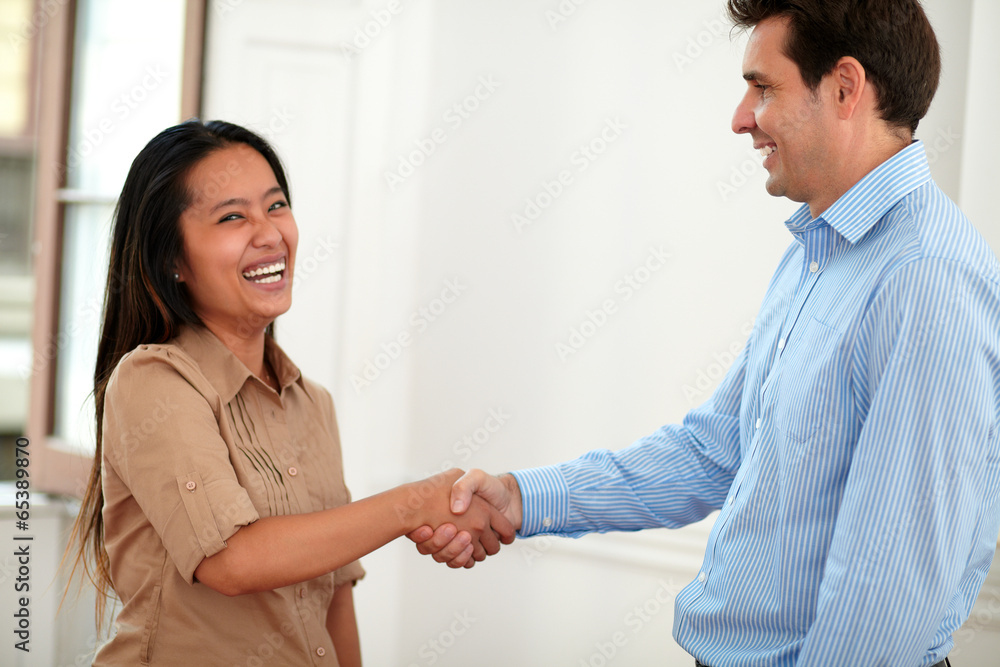 Cheerful asiatic lady giving hands greeting Cheerful asiatic lady giving hands greeting