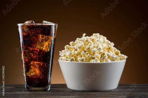 Popcorn and coke on the table
