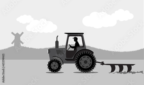 tractor processes the earth a rural landscape