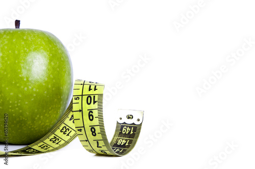 apple with tape measure, concept of healthy eating, lifestyle