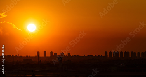 Sunset and cloud  over cityscape and airport © mathisa