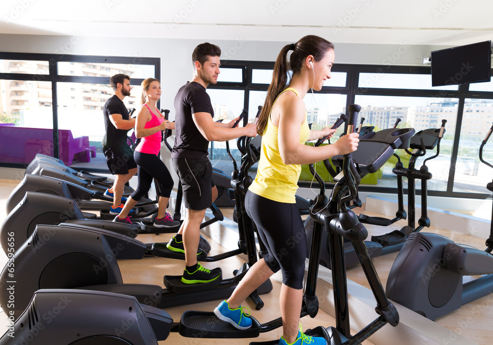 Aerobics elliptical walker trainer group at gym Aerobics elliptical walker trainer group at gym