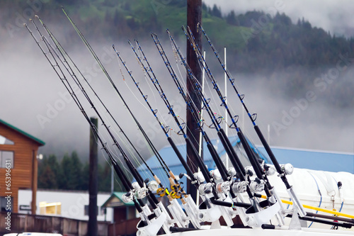 Fishing poles lined up on a boat in Alaska
