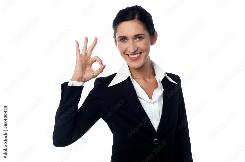 Business woman showing ok gesture Business woman showing ok gesture