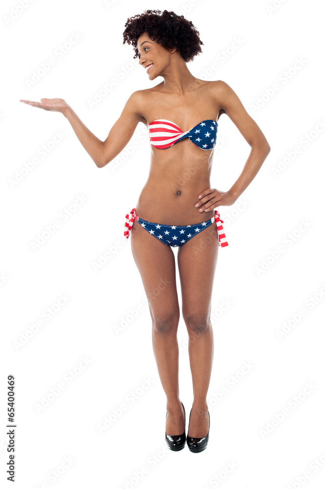 Glamorous bikini woman presenting copy space