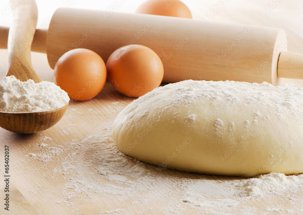 Dough on wooden table. Dough on wooden table.