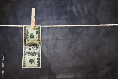 American Dollars hanging on rope photo