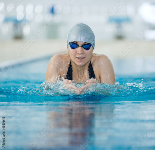 Photography Young girl in goggles swimming breaststroke stroke style