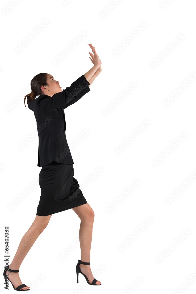 Businesswoman in suit standing and pushing up Businesswoman in suit standing and pushing up