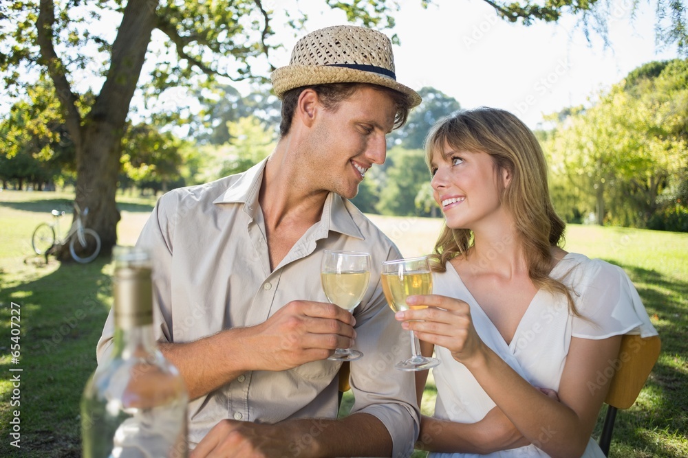 Cute couple drinking white wine together outside Cute couple drinking white wine together outside