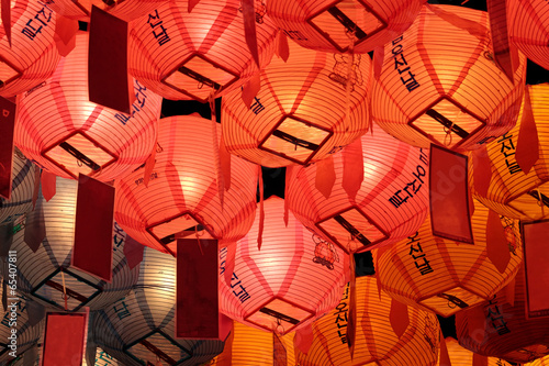 Glowing red, pink and yellow lanterns in night