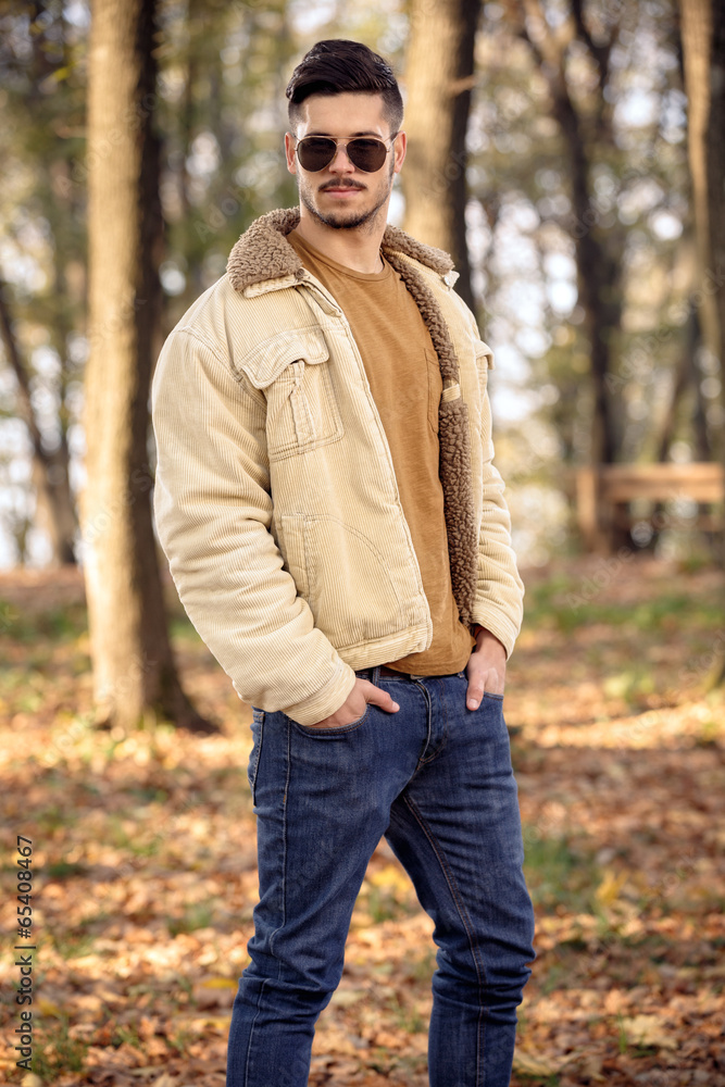 Young man wearing autumn fashionable clothing